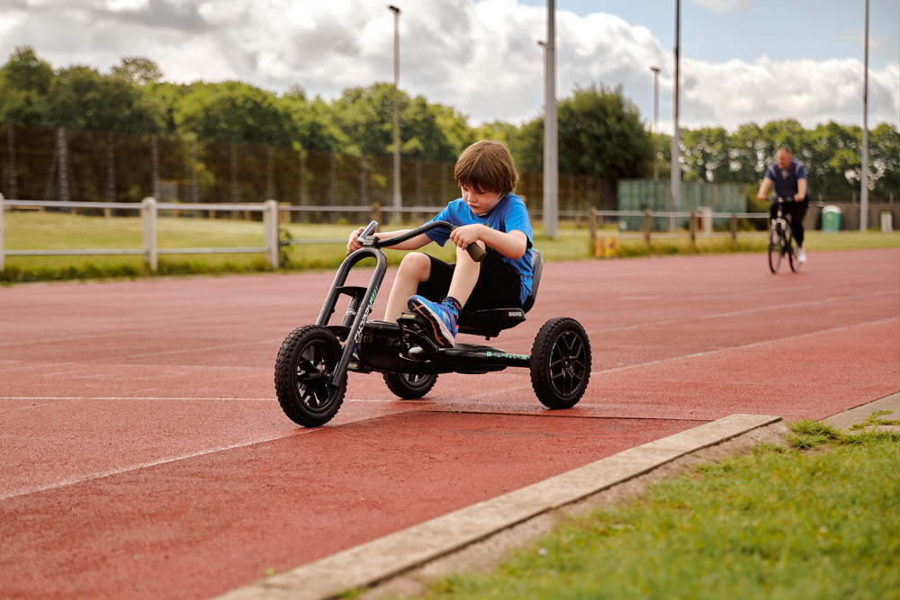 Child riding a go kart